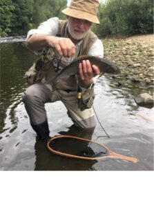 man showing trout caught in Yorkshire river