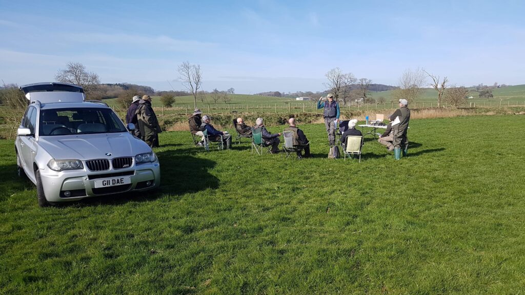 Fly fishermen receiving instruction