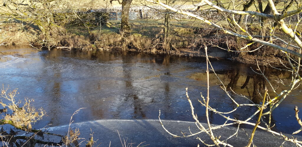 Ice on surface of river wharfe buckden